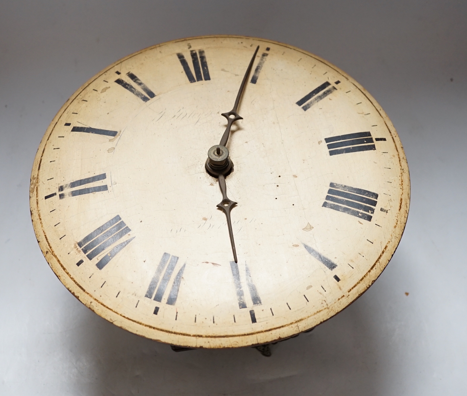 Two late 19th century wall clocks with painted dials, one striking on a bell with a mahogany surround